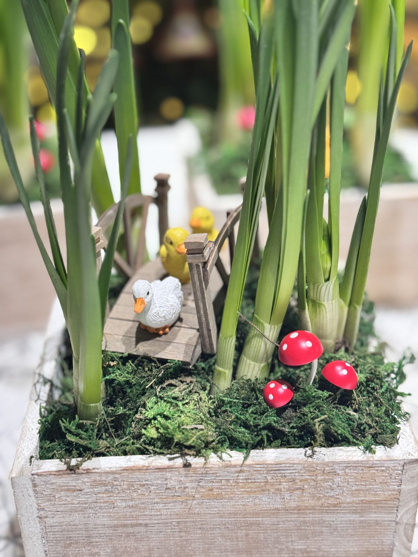 fairy garden ducks on a bridge